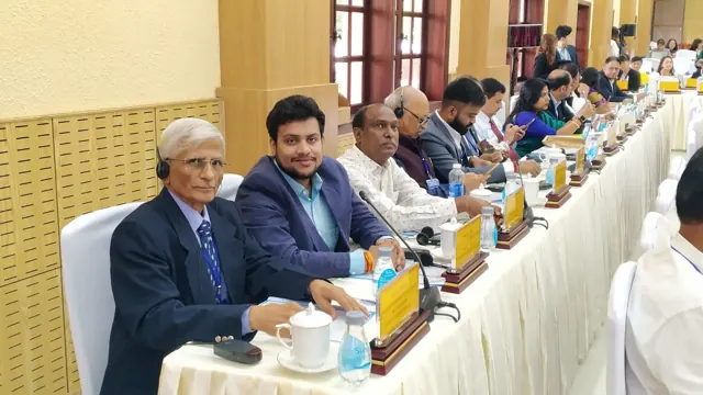 Delegation members participating in a formal business discussion
