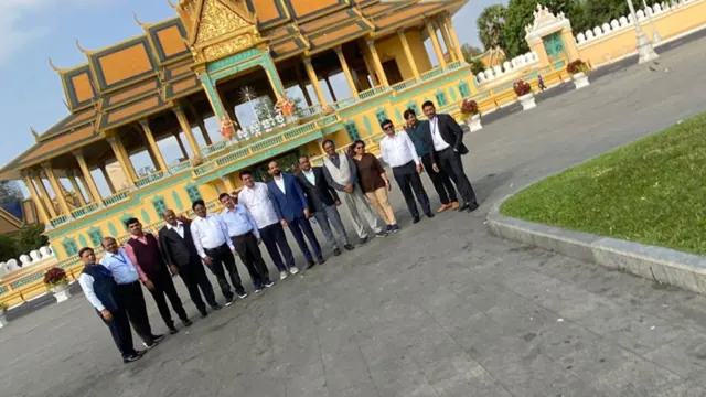 A visiting delegation gathered outside a host institution
