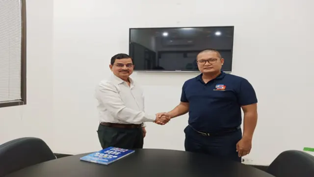 Two business representatives exchanging a document